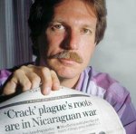 Gary Webb showing his article on the drug fall out of supplying the Nicaraguan Contras.